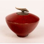 Tim Andrews (born 1960), a sang-de-boeuf crackle glaze pot, the lid with curled handle,
