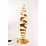 Tom Dixon (born 1959), a kinetic spiral floor lamp, steel with applied gold leaf, on a domed base,