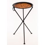 A modern occasional table, simulated tortoiseshell circular top on tripod legs,