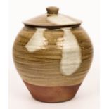 Phil Rogers (1951-2020), a stoneware storage jar and cover, ribbed with ash and nuka glazes,