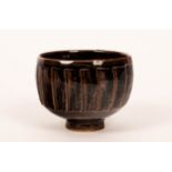 David Leach (1911-2005), a footed fluted bowl, temmoku glaze, impressed marks,