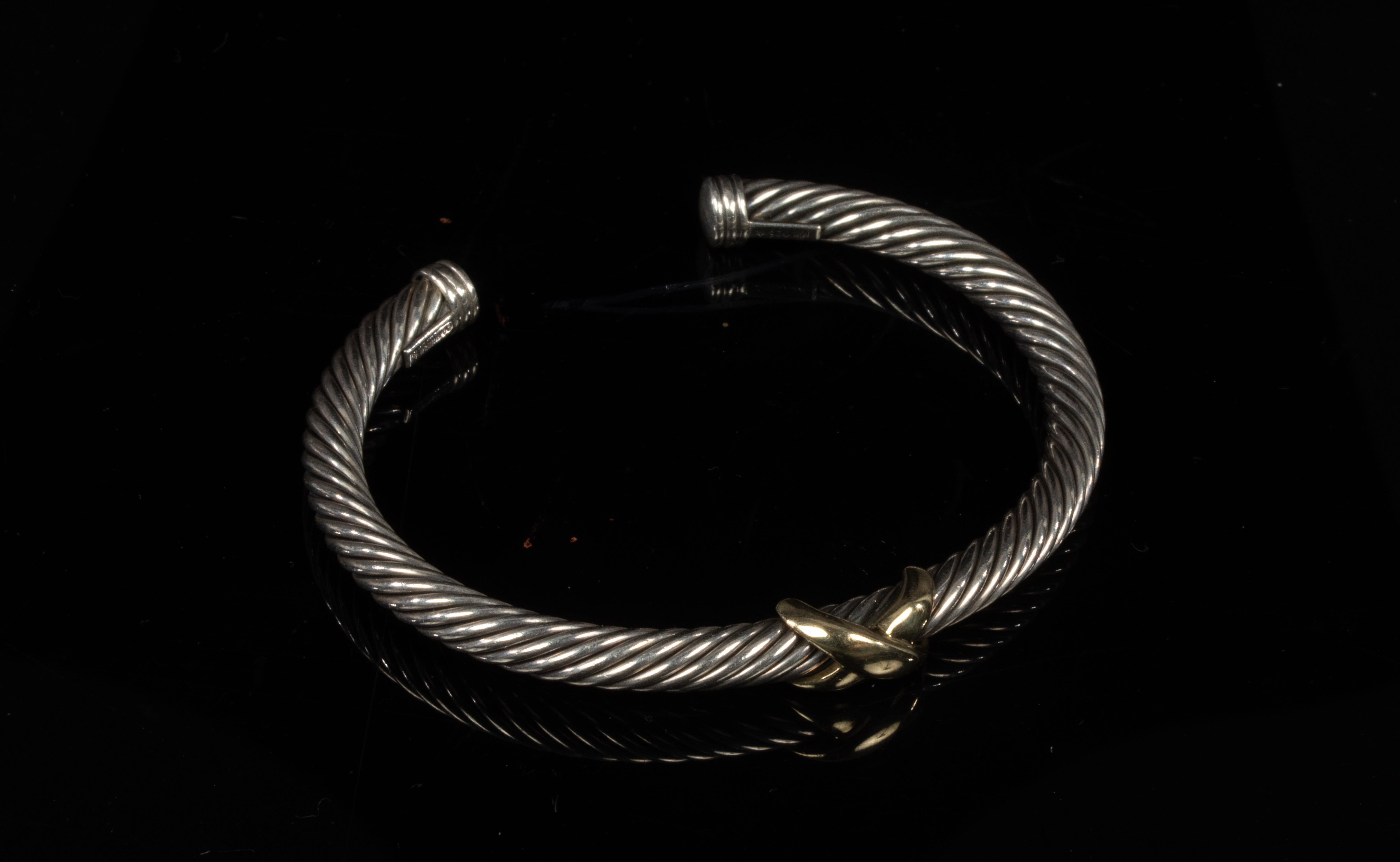 David Yurman, a silver and gold cable bangle, with central 14ct yellow gold cross, signed, - Image 2 of 3