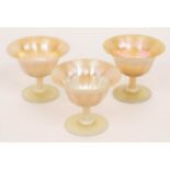 Tiffany, three Favrile footed bowls, with lustre finish, initialled L.C.
