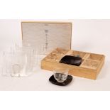 Hoya Crystal, a sushi set and a tea set of 5 engraved cups and 5 lacquer saucers,