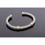 David Yurman, a silver and gold cable bangle, with two 14ct yellow gold collars, signed,