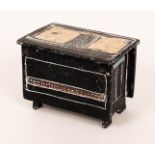 Sarah Jenkins (Contemporary), a stoneware casket, black and white glaze with gilt highlights,