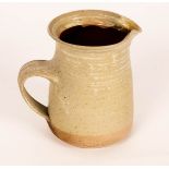 Mary Rich (born 1940), a stoneware jug, ash glaze, impressed marks, 15.