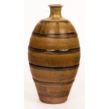 Phil Rogers (1951-2020), a stoneware bottle vase with ribbed banding, ash and tenmoku glazes,