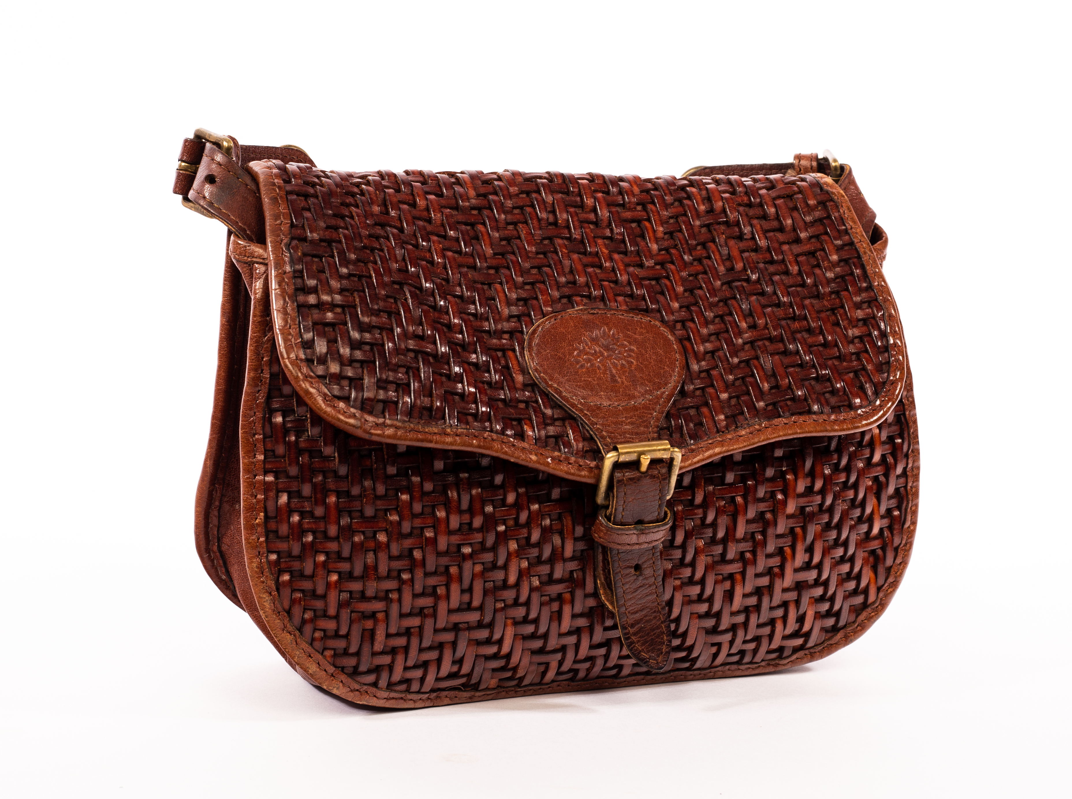 Mulberry, a brown leather woven handbag with shoulder strap, lined with zipped pocket,