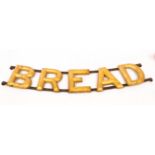 An advertising Bread sign (originally for Vitbe), gilt painted wood letters on a metal frame,