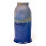 A Ruskin pottery vase with mottled and drip blue glazes, impressed factory mark, 22.