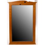 An oak framed mirror of modern design,