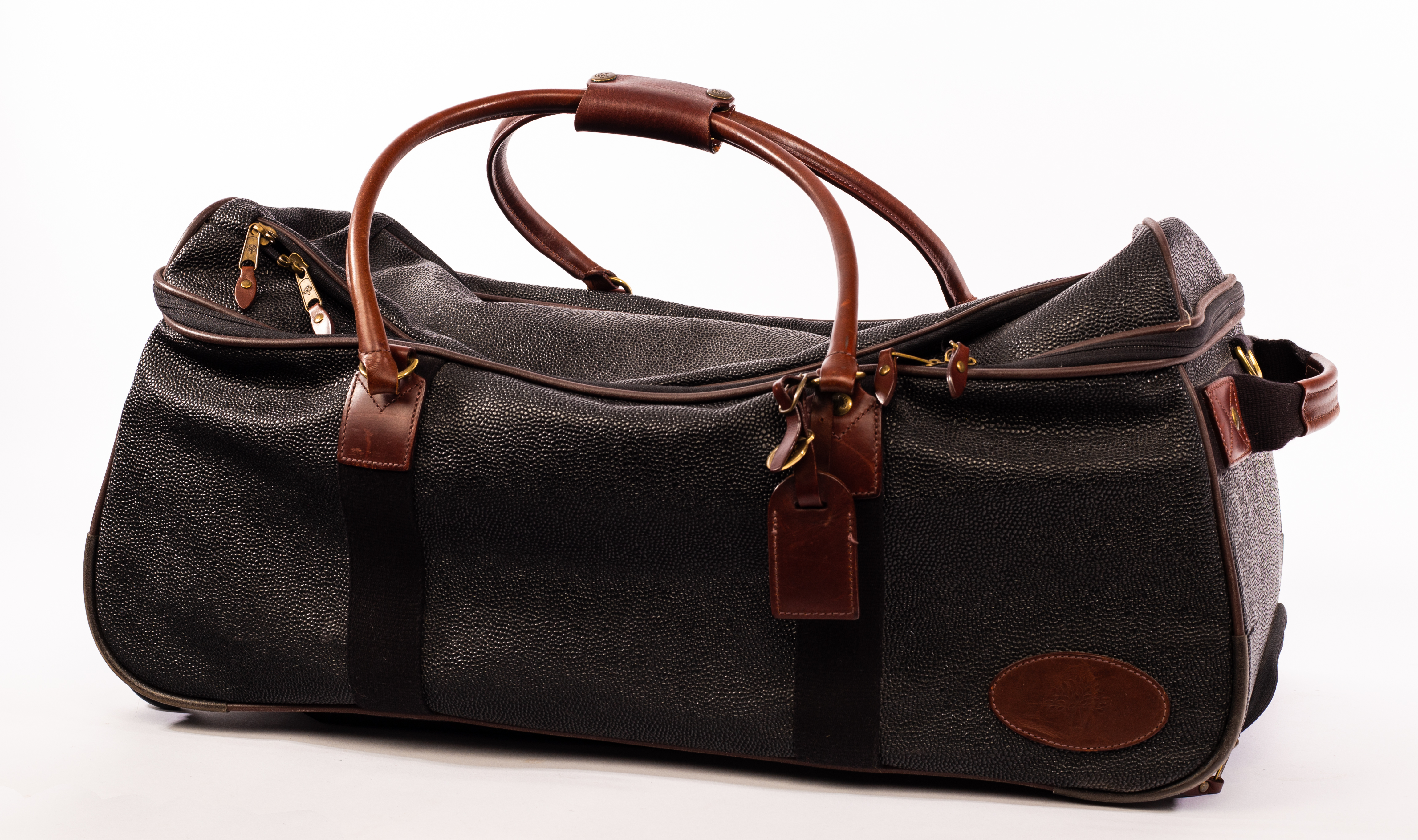 Mulberry, a black Scotchgrain travel bag with leather handles, pockets to exterior, luggage tag,