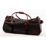 Mulberry, a black Scotchgrain travel bag with leather handles, pockets to exterior, luggage tag,