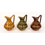 Celtic Ceramics, Kilrush, Ireland, three modernist jugs, glazed in ochre, green and brown,