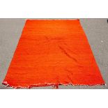 A hand woven Bedouin camel hair rug, in vivid orange, 293cm x 152cm and a smaller Bedouin rug,
