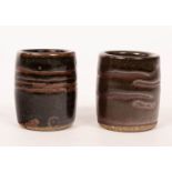 Leach pottery, two yunomi, tenmoku wax resist glaze, indistinct marks,