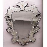 A Venetian glass mirror, approximately 50cm x 41cm CONDITION REPORT: Venetian mirror.