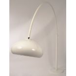 A 1970s white arc floor lamp, plastic shade and painted metal base and arm,