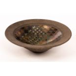 John Wheeldon (born 1950), a black stoneware bowl with lustre geometric designs to the well,