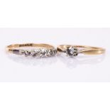 A diamond five-stone ring, the graduated stones set in 18ct gold and platinum,