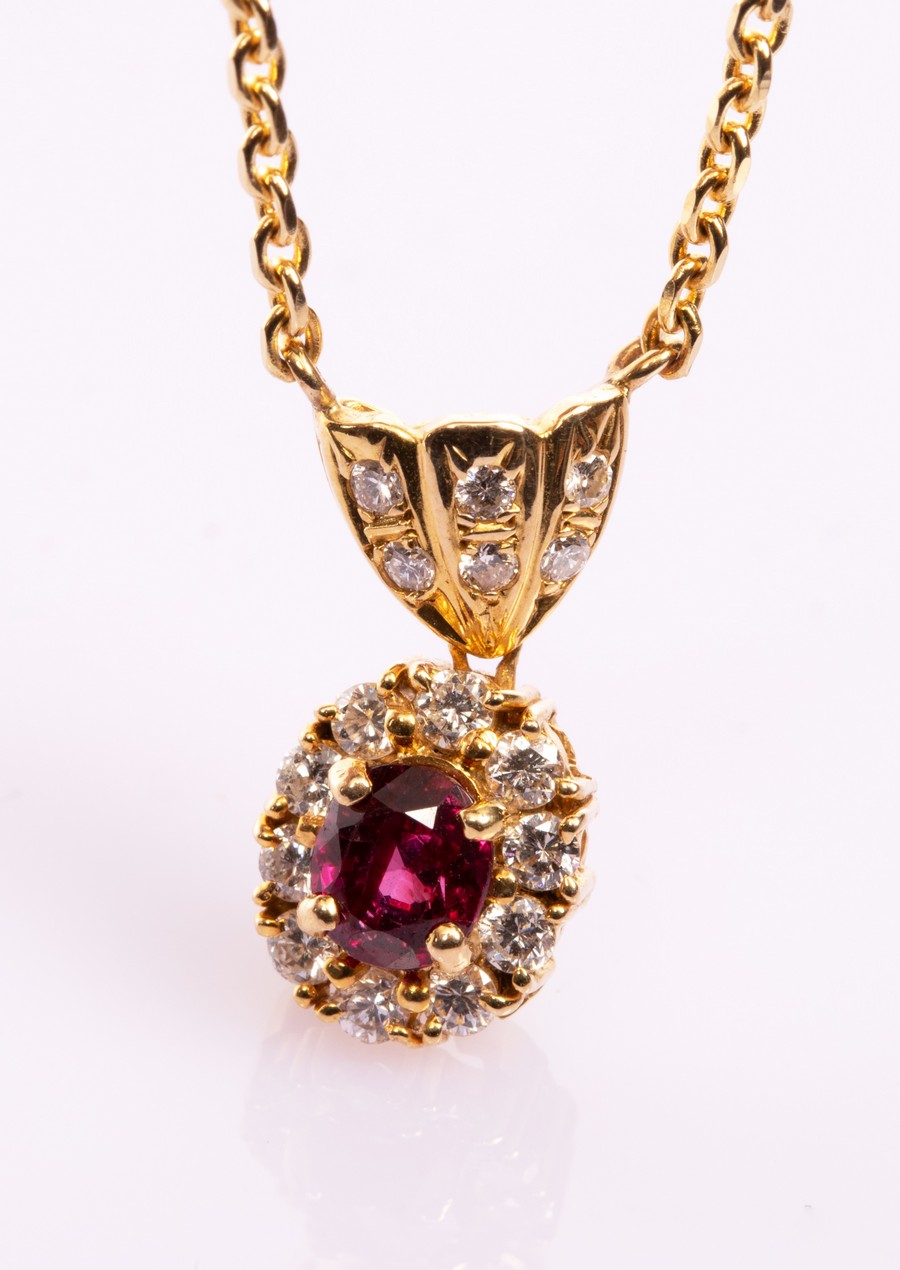 A ruby and diamond cluster pendant necklace,