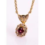 A ruby and diamond cluster pendant necklace,