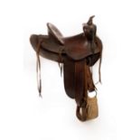 A leather Western saddle, J Harpham, decorated throughout/Note: From the Glenn Tutssel collection,