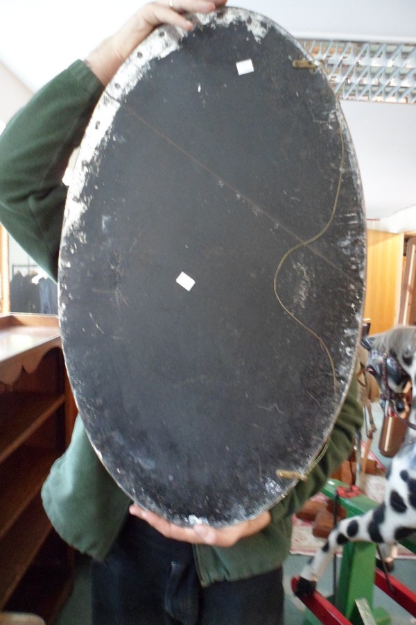 An oval copper framed mirror, 47cm x 80.5cm and a brass mirror of shaped oblong form, 38. - Image 2 of 3