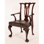 A George II style mahogany open armchair, with scroll crest rail above pierced splat,