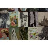 A loose leaf folder of fifty greeting and other postcards and approximately two hundred and fifty