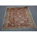 An Agra design hunting rug, India, decorated lion, leopard and deer amongst scrolling foliage,