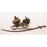 An Indian brass censer modelled as a man riding a bull, 16cm long, another with horse finial,
