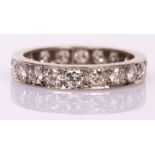 A diamond eternity ring set with twenty brilliant cut stones in a platinum mount,