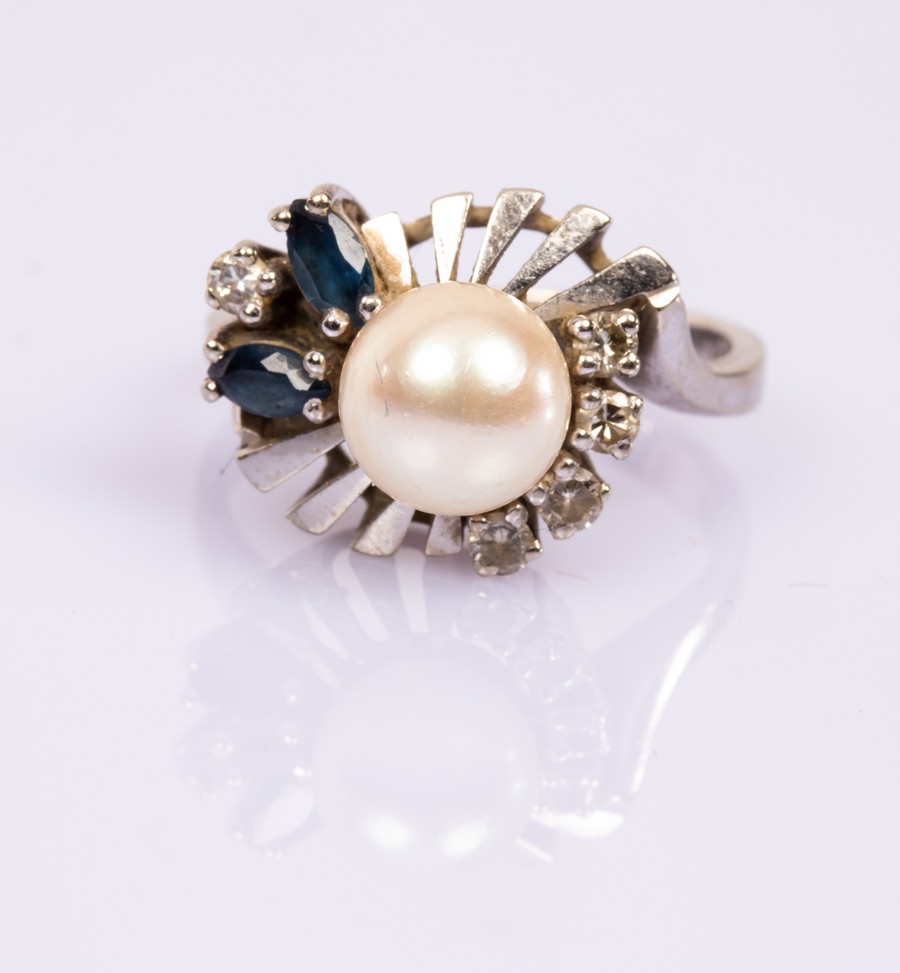 A pearl, diamond and sapphire dress ring, of modern design set in 14k white gold, size M,