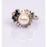 A pearl, diamond and sapphire dress ring, of modern design set in 14k white gold, size M,