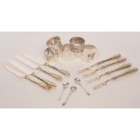 A set of four silver handled fruit knives and forks,