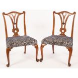 A pair of 18th Century style chairs, with pierced splat backs and cabriole front legs,