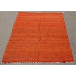 A hand woven Bedouin camel hair rug, in vivid orange, 293cm x 152cm and a smaller Bedouin rug,