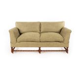 A Howard & Sons Victorian two-seat sofa, the drop ends with adjustable heights,