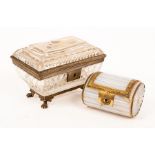 A mid 19th Century sarcophagus shaped glass box with gilded mounts and painted gilt flowers,