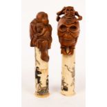 A Japanese carved boxwood and bone scroll holder, the bone cylinder carved with dancing skeletons,