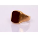 An 18ct yellow gold signet ring, James William Benson, London 1914, set with a carnelian plaque,