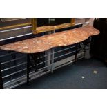 A console table with marble top having iron end supports with Prince of Wales plumes,