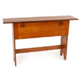 An oak Arts & Crafts side cabinet, the fall front enclosing shelves and a small cutlery drawer,