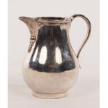 A silver pear-shape cream jug, Arthur Martin Parsons & Frank Herbert Parsons, London 1923,