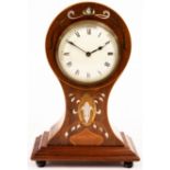 An Art Nouveau mahogany balloon cased eight-day mantle clock, inlaid stylised designs in boxwood,