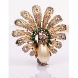 A novelty sterling silver costume brooch modelled as a peacock with a faux pearl body,