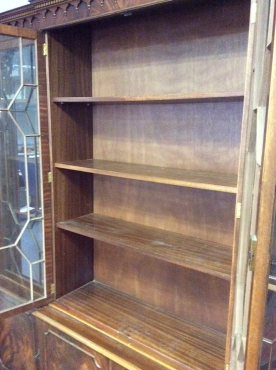 A mahogany breakfront bookcase, the glazed doors with panel doors beneath, - Image 4 of 4