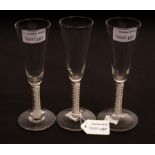 A pair of 18th Century drawn stem wine glasses with mercury twist stems,